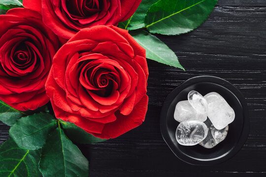Red Roses and Clear Quartz on Black Background