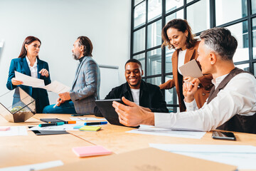 Group of business people have a meeting about company stats