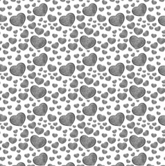 Seamless pattern with stone hearts on white.