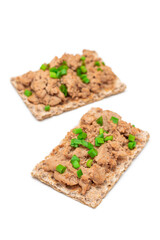 Crispy Sandwich with Chicken Pate and Green Onions Isolated on White Background - Top View. Whole Grain Bread with Liver Pate. Diet Breakfast and Healthy Food