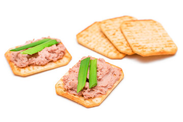 Crispy Salted Crackers with Liver Pate, Green Onions and Olives - Isolated on White. Easy Snack - Isolation