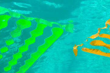 Fototapeta na wymiar Air matress floating in swimming pool seen from under water
