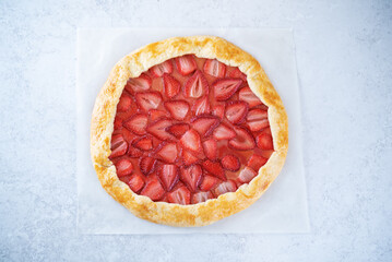 Strawberry galette on a paper sheet