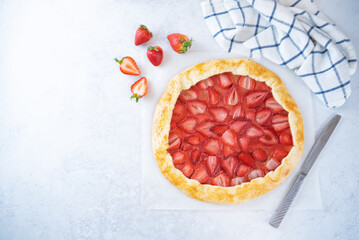 Strawberry galette on a paper sheet