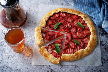 Strawberry galette on a paper sheet