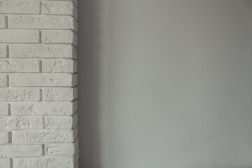 White decorative brick on a white wall. Horizontal brick tile texture background. Scandinavian interior.