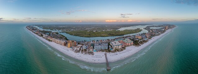 Drone panorama over Redington Beach in St. Petersburg in Florida with pier at sunset