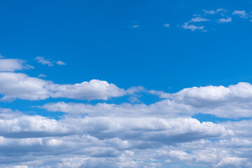blue sky and white stratocumulus clouds.