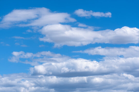 blue sky and white stratocumulus clouds.