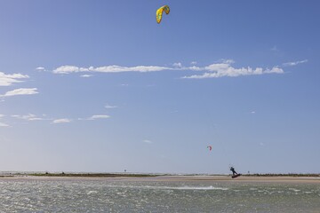 Picture of kitesurfers in stormy weather and sunshine in Florida