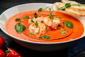 Delicious cold tomato soup or gazpacho with shrimps.