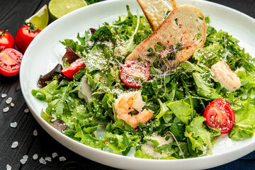 Fresh caesar salad with shrimps