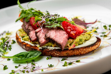Bruschetta with tender beef, cream cheese and gluacomoli sauce