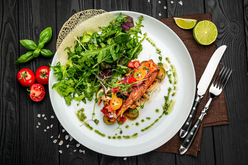 Grilled salmon fillet with vegetables mix.