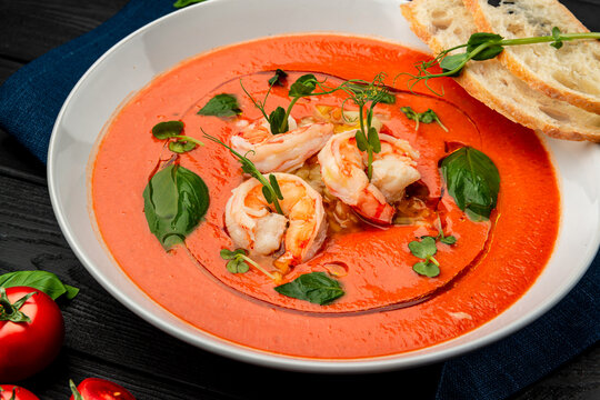 Delicious cold tomato soup or gazpacho with shrimps.