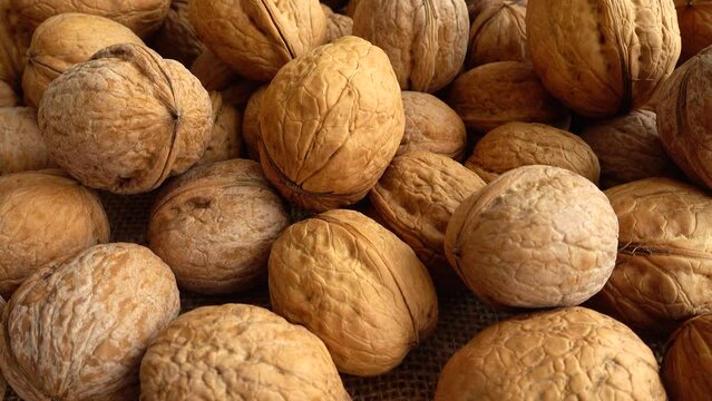 Walnuts on burlap. Shooting with a slider.