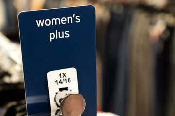 Woman plus size session for clothes shopping in department store