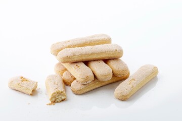 Stacked Italian Cookie Savoiardi. Sweet Biscuits. Sponge Cookies for Tiramisu Isolated on White Background.