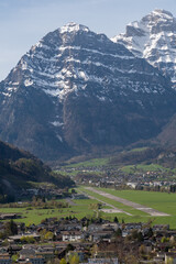 Fototapeta na wymiar Mollis airport in a fantastic mountain scenery in Switzerland