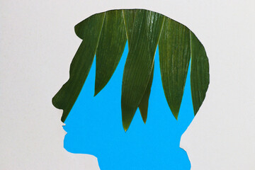 paper head with green leaves instead of brain, creative process, coming up with an idea, the idea comes to mind
