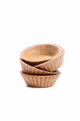 Stack of empty tartlets (tarts, tart shells) isolated on the white background