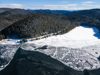 Aerial view of Golyam Beglik Reservoir covered with ice, Bulgaria