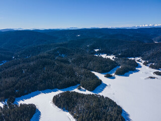 Aerial view of Golyam Beglik Reservoir covered with ice, Bulgaria
