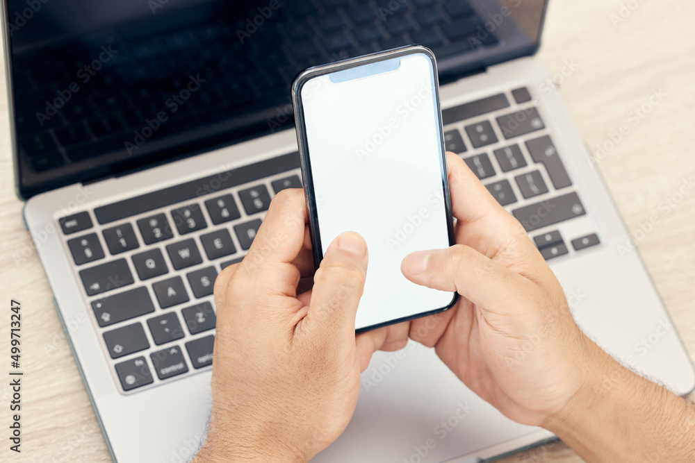 Aufkleber Work on all forms of technology. Shot of an unrecognizable businessman using a phone in an office at work.