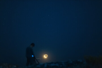 photographer watching the moon