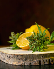 Close up of fresh Cannabis buds and lemons - 499714452