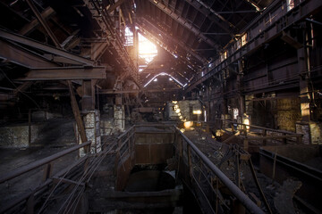 Old rusty abandoned metallurgical plant. Ruined blast furnace