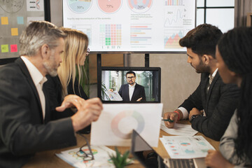 Electronic meeting concept. Diverse group of multiracial business people in the conference room...