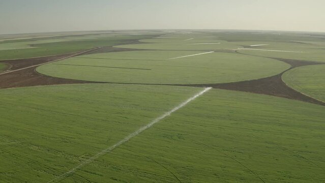 The vast circular agricultural fields in Turkey while irrigation system is running.