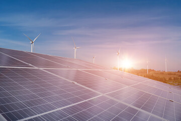 Solar panel and wind turbine field at sunset sky background. photovoltaic, alternative electricity...