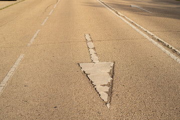 Pavement signs in the sunset