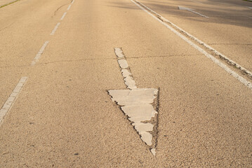 Pavement signs in the sunset