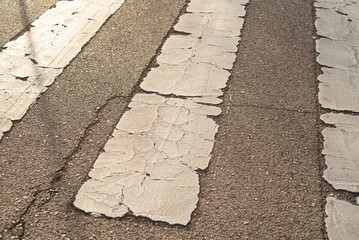 Pavement signs in the sunset