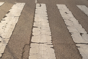 Pavement signs in the sunset