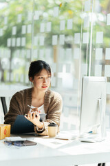 Portrait young attractive asian female owner startup business work happy with box at home prepare...