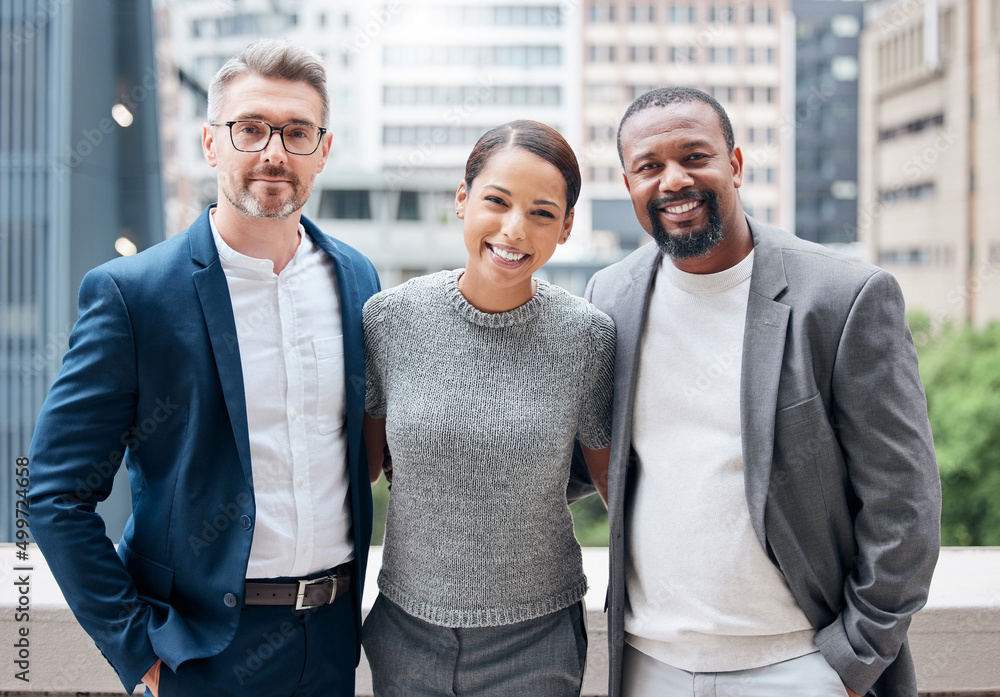 Poster learned the value of working hard, by working hard. portrait of a group of businesspeople enjoying a