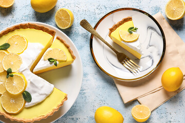 Plate and stand with tasty lemon pie on blue background