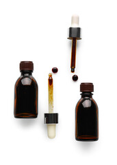 Bottles and pipettes with iodine on white background