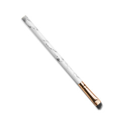New makeup brush on white background