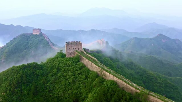 Aerial view of watch towers on the Great Wall of China and the surrounding misty mountains