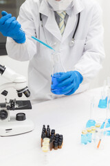 Fototapeta premium Medical Science Laboratory: Portrait of a beautiful scientist looking under a microscope analyzing a test sample. Ambitious young biotechnology specialist work with advanced equipment