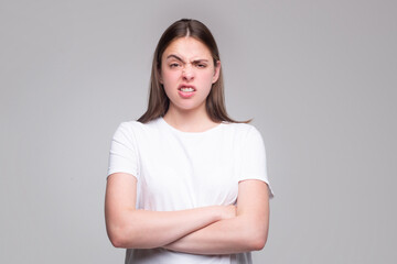 Fototapeta premium Emotional angry woman, upset girl. Screaming, hate, rage. Pensive woman feeling furious mad and crazy stress.