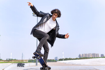 Man with his skateboard outdoor.