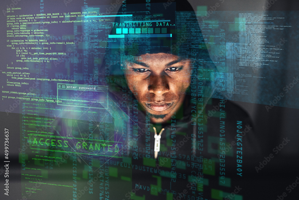 Fototapete you could be his next victim. shot of a hacker cracking into a network in the dark.