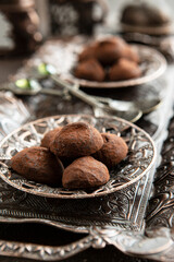 Sweet chocolate  candies sprinkled with cocoa powder