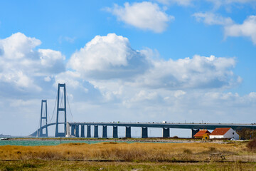 korsoer, denmark, 09 april 2022, beach with a view to the famous bridge over the storebelt